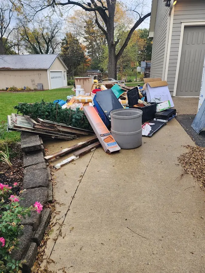 Dumpster being loaded with debris for 10 Yard Dumpster Rental in Canaan